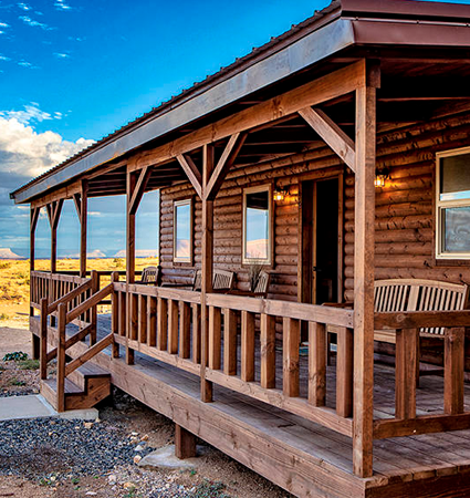 Experience a spectacular sunset and sunrise on an incredible Grand Canyon West Hualapai Ranch overnight cabin stay by helicopter tour & ground tour!