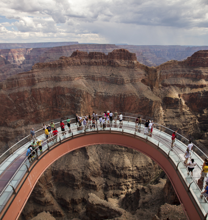 Grand Canyon Skywalk Express helicopter tour departing from Las Vegas. Incredible views of Hoover Dam & Bypass Bridge. Fly above and below the rim of Grand Canyon including front of the line VIP line pass access to Grand Canyon Skywalk
